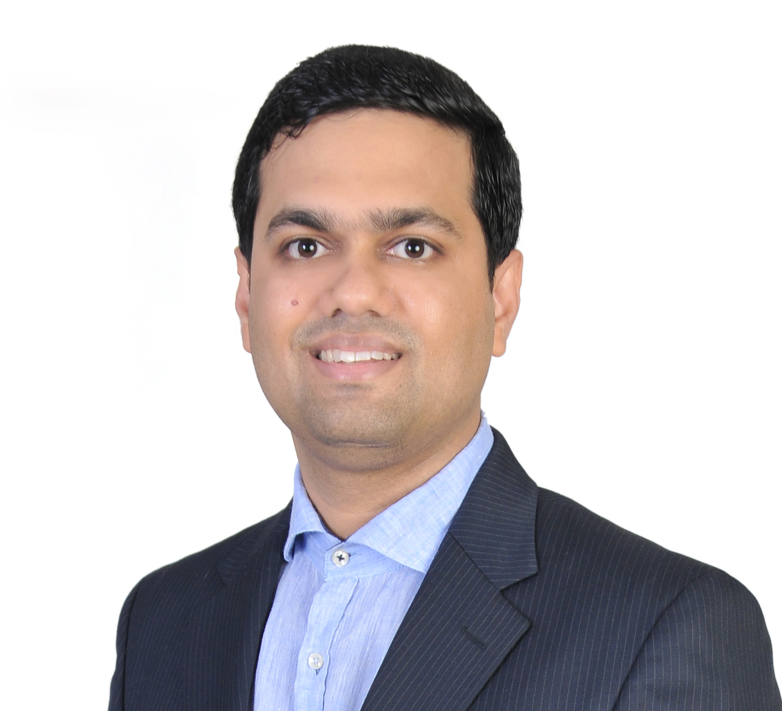 Portrait photo of Qutbuddin Habib, male with short hair, wearing a dark blazer and shirt, looking confident with folded arms